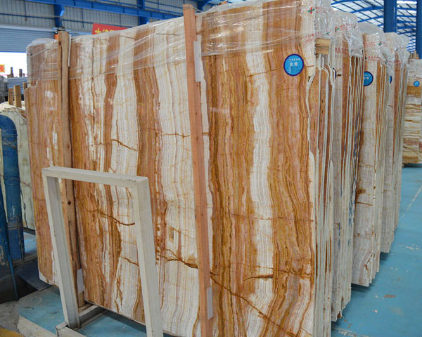 Imported white and golden wood grain marble slab