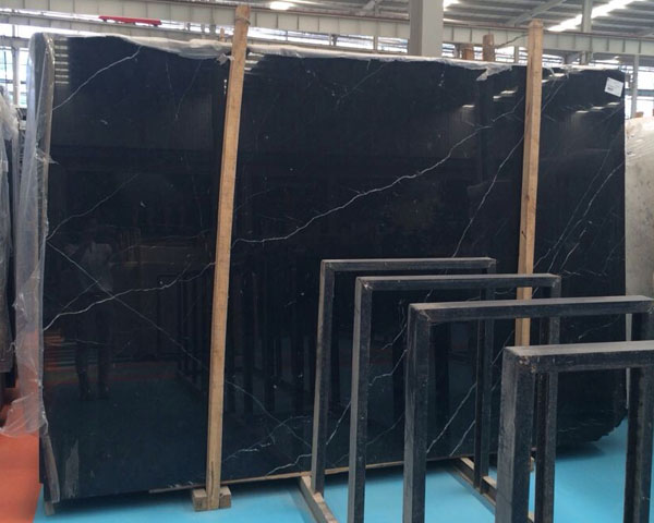 Polished black marquina nero marble with white veins