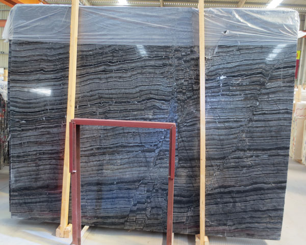 Polished ancient wood grain black marble slab
