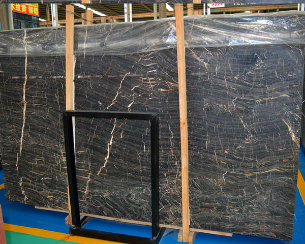 Imported black and gold emperador marble slab